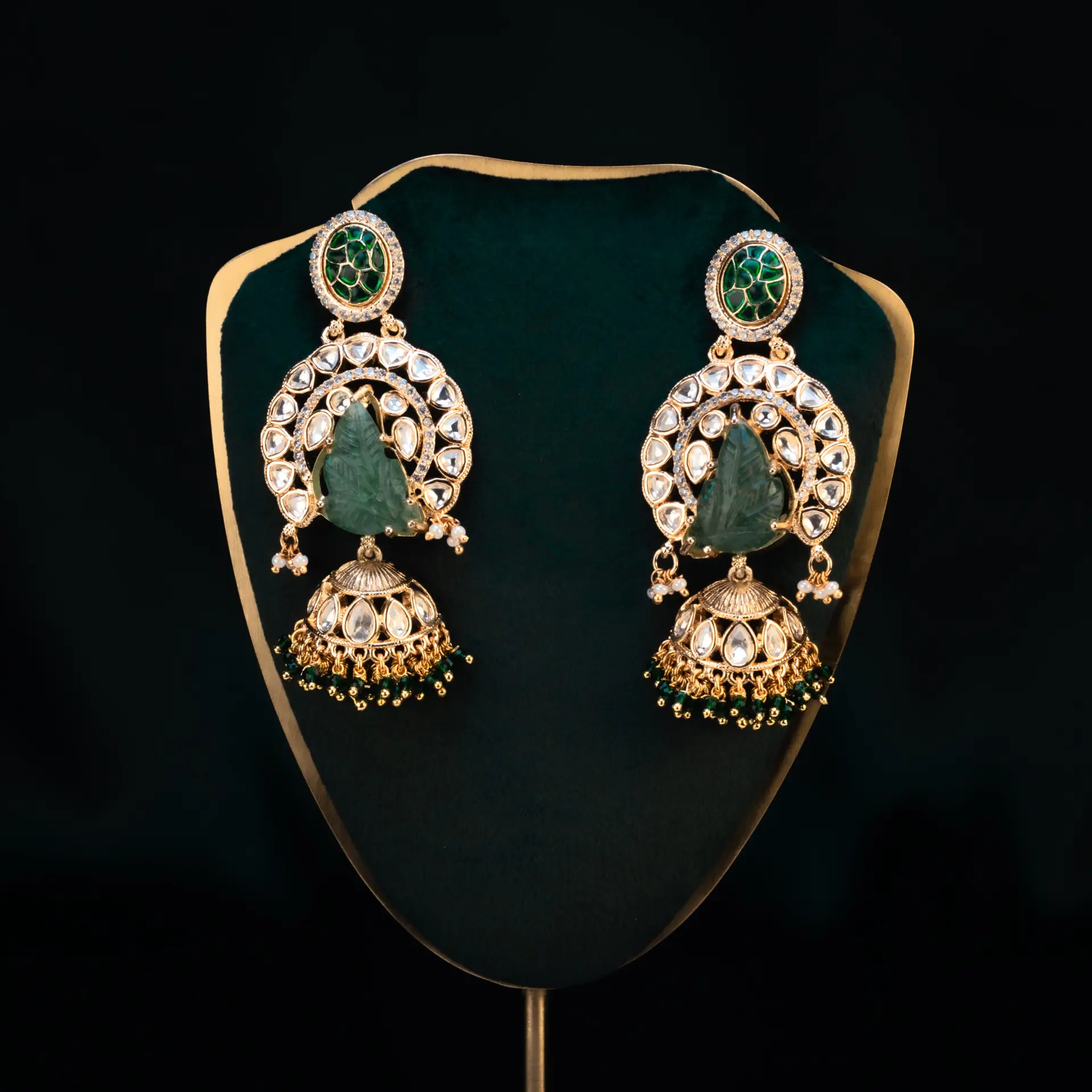 Elegant green gemstone earrings displayed