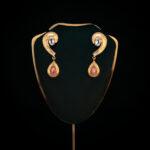 Elegant gold earrings with gemstones